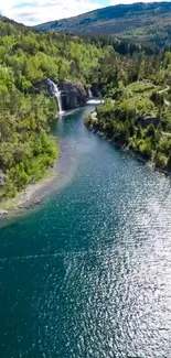 Aerial view of a river with a waterfall in a green forest landscape.