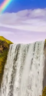 Scenic waterfall with rainbow and lush greenery in the background.