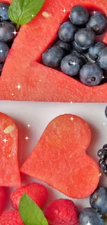 Heart-shaped watermelon and berry wallpaper with mint leaves.