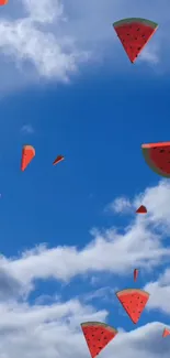 Watermelon slices floating in a bright blue sky with clouds.