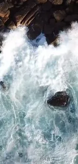 Aerial view of ocean waves crashing onto rugged rocks.