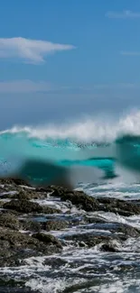 Turquoise waves crashing on a rocky shore under a blue sky.