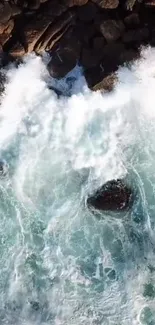 Mobile wallpaper of ocean waves crashing on rocks with a blue-green hue.