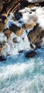 Aerial view of crashing ocean waves over rocky shoreline.