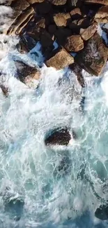 Rocks meet crashing ocean waves, capturing nature's raw power.