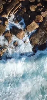 Aerial view of ocean waves crashing over rocky coastline.