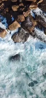 Aerial view of waves crashing onto rocky coastline.