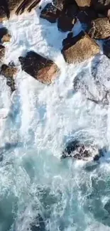 Aerial view of waves crashing on rocky coastline.