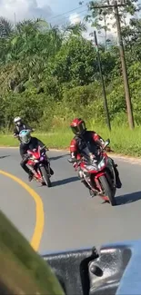 Motorcycle riders on a scenic road.