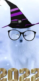 Arctic fox with witch hat and 2022 text in snowy scene.