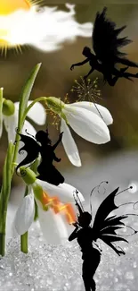 Fairies dance around snowdrop flowers under a bright sun on a snowy background.