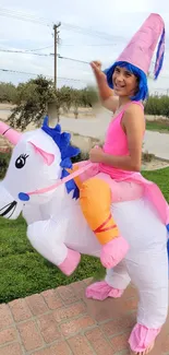 Colorful unicorn costume wallpaper with pink and blue accents in an outdoor setting.