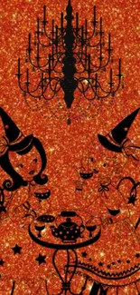 Whimsical witches under a chandelier on a sparkling orange background.