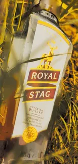 Royal Stag whisky bottle in sunlit grass with elegant presentation.