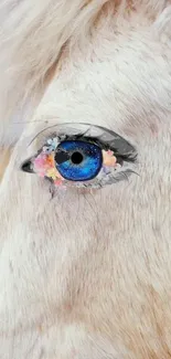 Artistic illustration of a blue eye with floral accents.