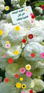 A beautiful bouquet of white roses with green leaves.