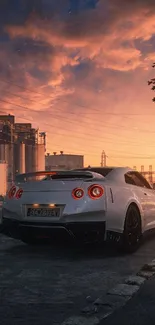 White sports car in urban sunset background.