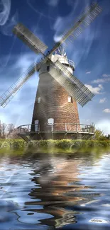 Windmill reflecting on water under a clear blue sky, creating a serene mobile wallpaper.