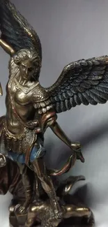 Bronze statue of a winged warrior with detailed features.