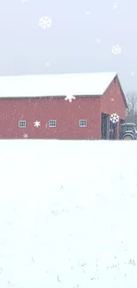 Red barn in snowy field with falling snowflakes.