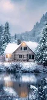 Snow-covered cabin beside a tranquil lake in winter.