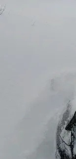 A car driving through deep snow, creating an adventurous winter scene.