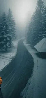 Snowy road through winter forest with misty ambiance.