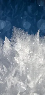 Delicate frost crystals on blue background, mobile wallpaper.