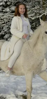 Woman riding white horse in snowy forest scene.