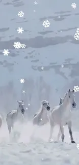 Snowy winter scene with horses running gracefully.