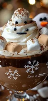 Festive cup of hot cocoa with marshmallows and whipped cream in a playful snowman theme.