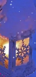 Snow-covered lantern with golden glow and starry blue backdrop.