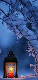 Serene winter scene with lantern glowing under snow-covered branches.