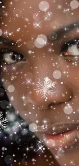 Close-up of a face with snowflakes and shimmer on a mobile wallpaper.