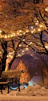 Winter night with glowing lights and snow-covered park bench.