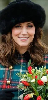 Woman in plaid dress with fur hat and bouquet