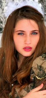 Winter portrait of a young woman with snowflakes.