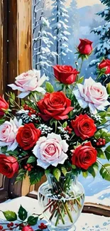 Bouquet of red and white roses against snowy winter landscape in a glass vase.