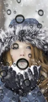 Woman in blue coat with snowflakes falling.