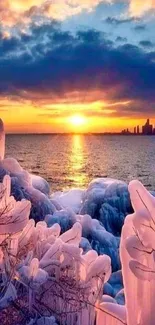 Vibrant winter sunset over icy shoreline with city skyline.