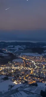 A snowy town brightly lit under a starry winter night sky.