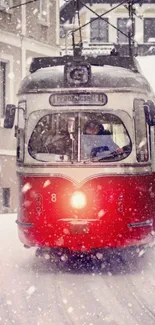 Red vintage tram on a snowy street in winter.