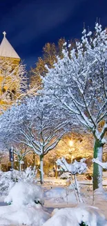 Snowy winter night scene with trees and architecture.