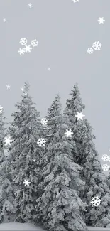 Snow-covered trees with falling snowflakes, creating a winter wonderland.