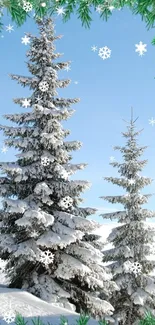 Snow-covered trees against a blue sky with snowflakes.