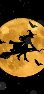 Silhouette of a witch flying across a full moon with bats in the night sky.