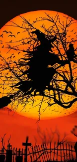 Witch flying on a broomstick against an orange moon with bats and trees.