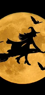 Witch silhouette flying across a full moon with bats.
