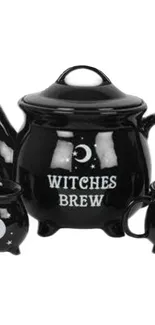 Black witches brew teapot with mystical moon design.