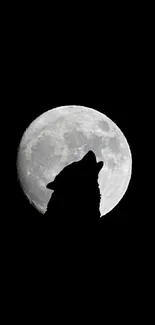 Wolf howling at the full moon in a dark night sky.